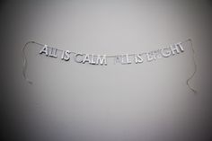 a banner that says, all is calm it is bright