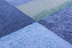 a close up view of a blue and green rug