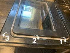 the bottom half of an oven door with three measurements on it and one showing where to put something in