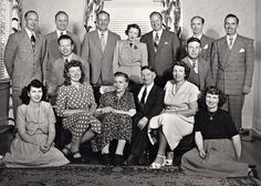 a group of people are posing for a black and white photo