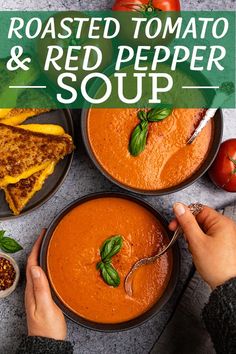 two bowls of roasted tomato and red pepper soup with toasted bread on the side