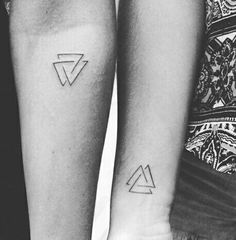 two people with matching tattoos on their arms