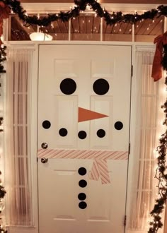 a door decorated with a snowman's face