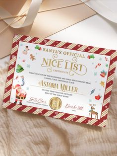 a santa's official nice list certificate on a bed