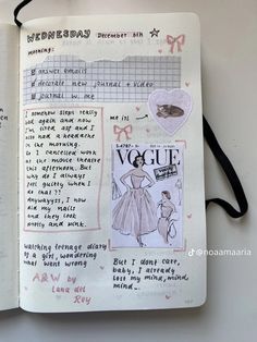 an open notebook with drawings and writing on the pages, including pictures of women in dresses