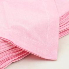 pink napkins stacked on top of each other