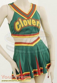 a green and yellow cheerleader uniform is on display