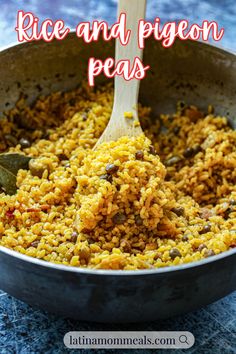 rice and pigeon peas in a skillet with a wooden spoon on the side text reads rice and pigeon peas