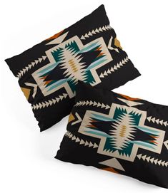 two black pillows with colorful designs on them