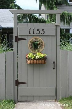 a gate with a potted plant on it