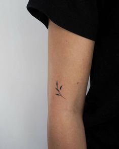 a woman with a small tattoo on her arm