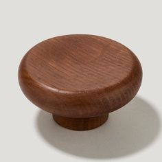 a wooden knob on a white background