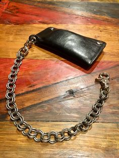 PLAIN JANE wallet chain made from durable 14 ga. carbon steel treated with rust inhibitor, finished with two swivel trigger clasps. Biker Wallet Men, Leather Cuff Men, Leather Watch Cuff, Wallet With Chain, Wallet Chains, Mens Wallets, Biker Wallet, Plain Jane, Chain Wallet