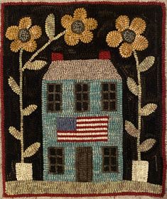 an embroidered house with sunflowers on it