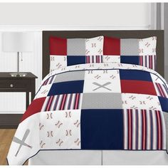 a baseball themed comforter set on a bed