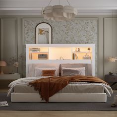 a bedroom with a bed, dresser and mirror on the wall next to each other