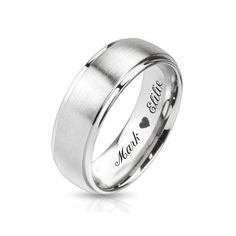 a wedding ring with the word love engraved on it