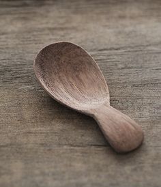 a wooden spoon sitting on top of a table