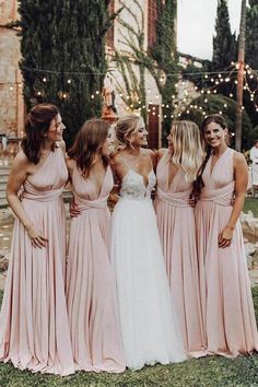 the bridesmaids are all dressed in pink dresses