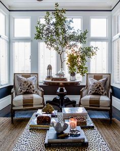 a living room with two chairs and a coffee table