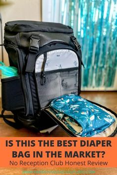 a diaper bag sitting on top of a wooden table