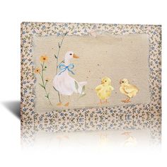 an embroidered picture frame with ducks and flowers