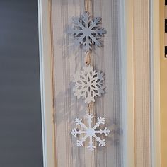 a snowflake hanging from the side of a door