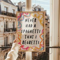 a sign that says never had a spaghetti that i regettoi hanging on a window sill