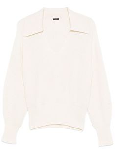 a white sweater with an open collar