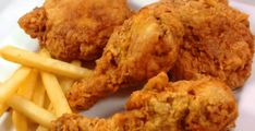 fried chicken and french fries on a white plate