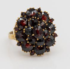 Antique Victorian Vermeil Garnet Cluster ring. The Total weight is 6,75 gr. The ring size is 8,5. The measurement of the ring are top to bottom 25 mm, Left to right 20 mm. This antique Victorian garnet cluster ring looks like an actual pomegranate that has been split open revealing its glowing, red gemmy seeds. The rich wine color changes to a fiery scarlet as you move your hand and it catches the light. The perfect piece for someone who loves this deep burgundy hue and that would make a special Garnet Cluster Ring, Heirloom Gold Cluster Ring With Garnet, Heirloom Style Red Garnet Cluster Ring, Red Garnet Cluster Ring, Victorian Ruby Cluster Ring With Gemstones, Vintage Red Garnet Cluster Ring, Gorgeous Rings, Dream Rings