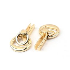 two pairs of gold - plated cufflinks, one with a circular link