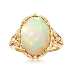 Ross-Simons - Ethiopian Opal, .28ct t. w. Diamond Ring Oval Cut in 14kt Yellow Gold. Size 6. Feast your eyes on this unique ring! A smooth 12x16mm oval cabochon of Ethiopian opal looks luminous in polished 14kt yellow gold. The fancy setting sparkles with .28 ct. t. w. round brilliant-cut diamonds, further adding to the beauty of the piece. 3/4" wide. Diamond and Ethiopian opal ring. Opal birthstones are the perfect gift for October birthdays. Diamond Ring Oval, October Birthdays, Antique Rings Victorian, Opal Birthstone, Ethiopian Opal Ring, Ring Opal, Pink Sapphire Ring, Diamond Solitaire Necklace, Halo Earrings