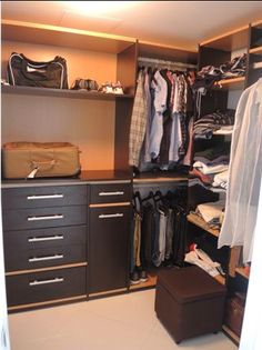 the closet is full of clothes and other items