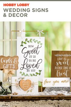 wedding signs and decor displayed on a table