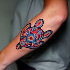 a person with a colorful tattoo on their arm