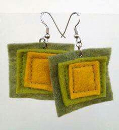 two square shaped felt earrings hanging from silver earwires on a white background with green and yellow squares