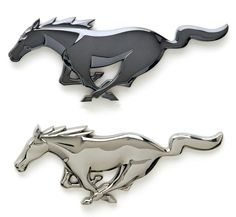 two silver and black horse brooches on white background