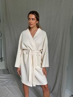 Looking for a cotton bathrobe that's as comfortable as it is stylish? Our kimono bathrobe is the perfect choice for you. This waffle bathrobe is handmade with love from the finest certified organic cotton, and it's the epitome of luxury and quality. It's incredibly durable, ensuring you'll enjoy its softness for years to come. This white waffle robe is made from cotton that meets the stringent OEKO-Tex ecological standards, assuring you that it's free from harmful substances and eco-friendly. Whether you have sensitive skin or not, this bathrobe is a dream to wear. Upgrade your relaxation with our 100% organic cotton bathrobe today! ✅ FEATURES: 👉 Handmade with love. 👉 100% organic cotton. 👉 Oversized and comfy. 👉 Robe has a pocket. 👉 Beautifully wrapped and boxed. The model height: 17 Cotton Long Sleeve Overnight Robe, Long Sleeve Cream Robe For Home, Cream Long Sleeve Home Robe, Beige Cotton Robe For Daywear, Waffle Bathrobe, Comfy Robe, Kimono Bathrobe, Cotton Bathrobe, Kimono Style