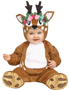 a baby wearing a deer costume with flowers on its head and antlers around his neck