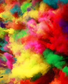 colorful powder is mixed in with each other to create an abstract pattern on the surface