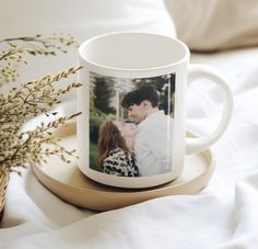 a white coffee mug with a photo on it