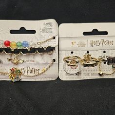 two harry potter bracelets with charms on them