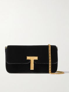 There's a reason velvet lines jewelry boxes - it accentuates the luster of hardware gorgeously. TOM FORD's clutch drapes from a chain strap and fastens with a gilded 'T' charm that both gleam under light. It'll hold small essentials like a phone, lipstick and cardholder. Tom Ford Jewelry, Tom Ford Bag, Velvet Clutch, Fine Jewelry Designers, Watch Gifts, Jewelry Boxes, Summer Hats, Clothes Collection, Chain Strap