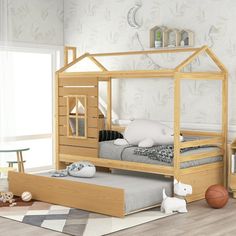 a child's bedroom with a wooden bed and toy animals on the floor next to it