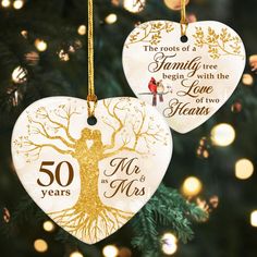 50th anniversary ornament with tree and couple on it's heart shaped ornament