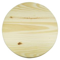 a round wooden cutting board on a white background