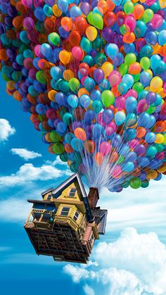 a house floating in the air with balloons attached to it's roof and bottom