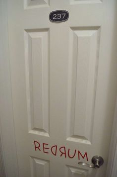 a white door with the word redrum painted on it's side and an inscription that reads,