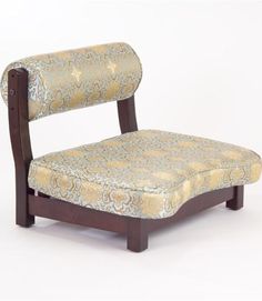 a wooden chair with a patterned upholstered seat and wood frame, against a white background